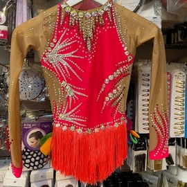 Coral leotard with a special skirt for rent