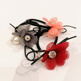 Hair tie with a flower